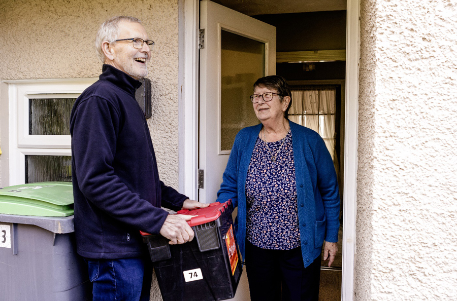 A volunteer for Food Train in Stewartry delivers food to a resident's door