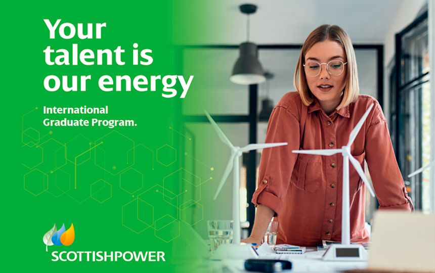 women looking at wind turbine models