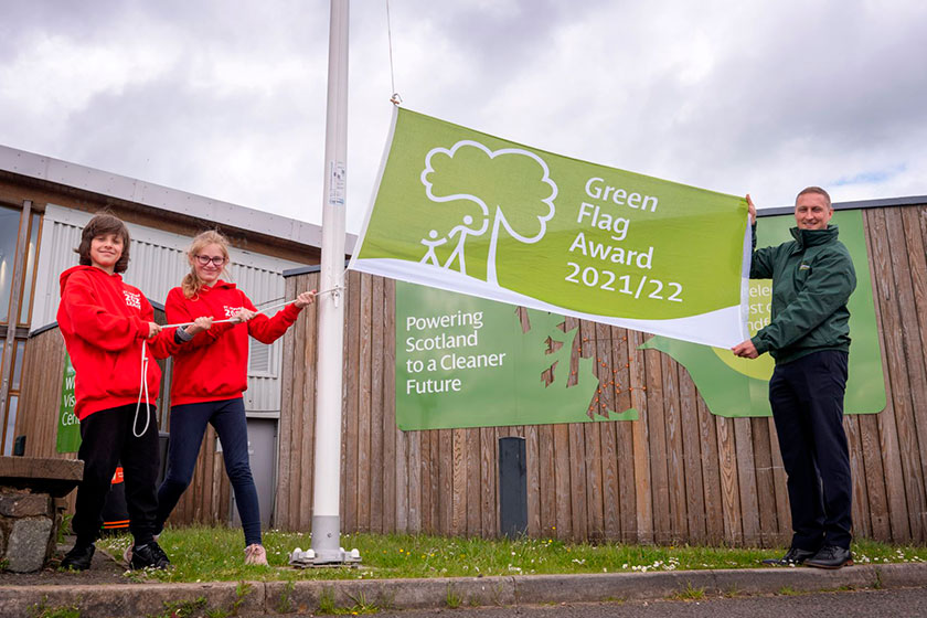 people holding Green Flag