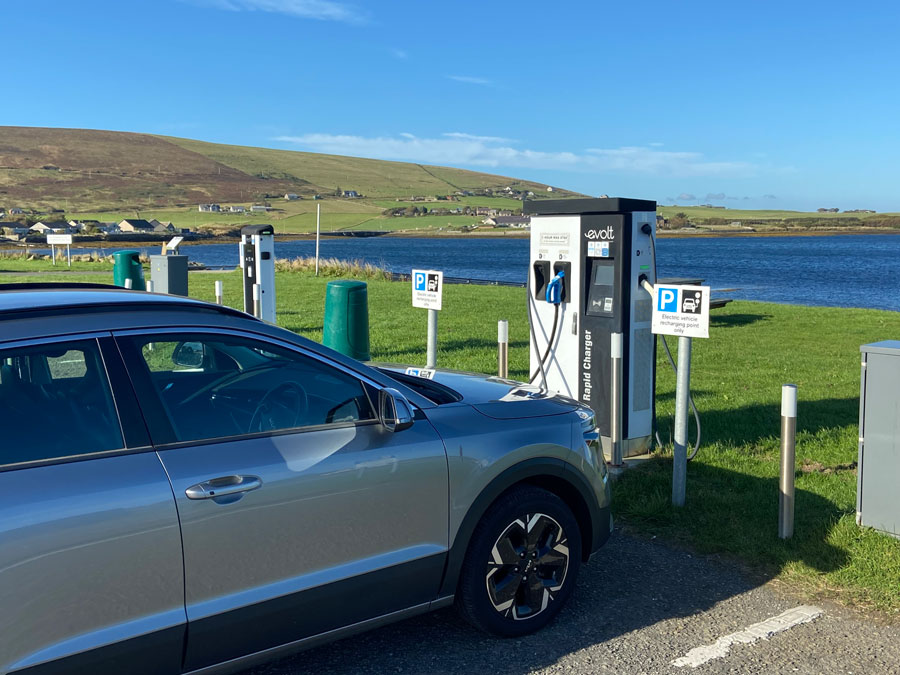 Electric car charging at an electric charging station.